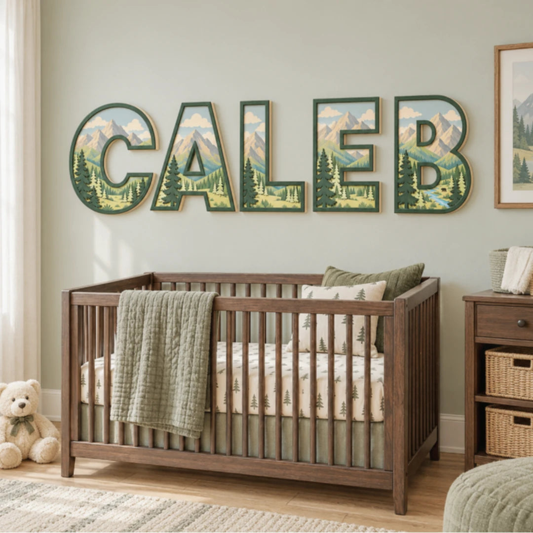 CALEB mountain landscape nursery letters displayed above a crib