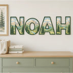 NOAH personalized mountain and evergreen tree nursery letters above a dresser